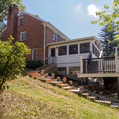 new retaining wall, stairs, deck and screened porch addition