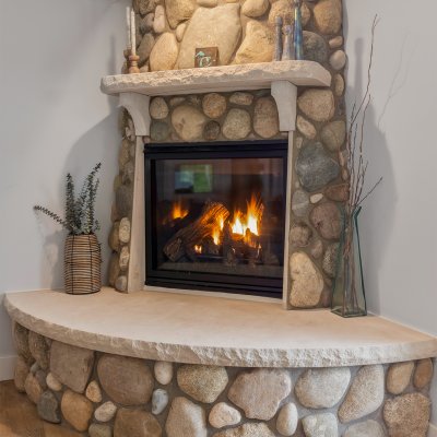 Fireplace in living room with local stone hearth and chimney