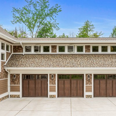 Three car garage with gym,  sports lounge, and craft room above