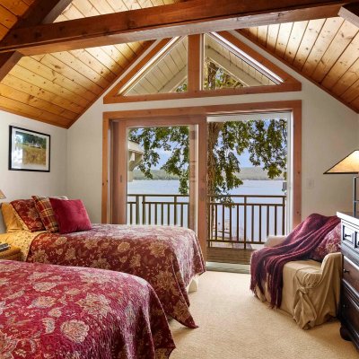 loft bedroom with lake view and balcony